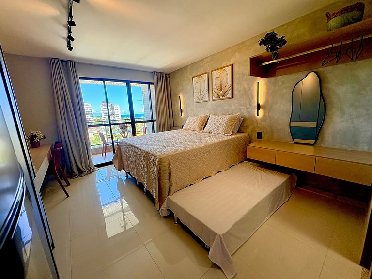 Studio moderno e elegante com vista para o mar