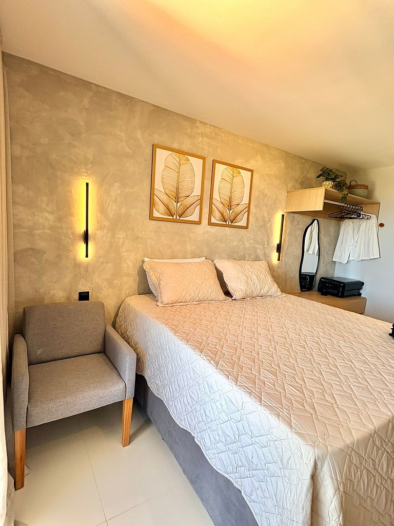 Studio moderno e elegante com vista para o mar