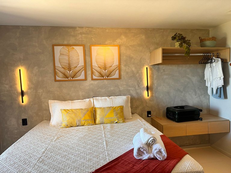 Studio moderno e elegante com vista para o mar