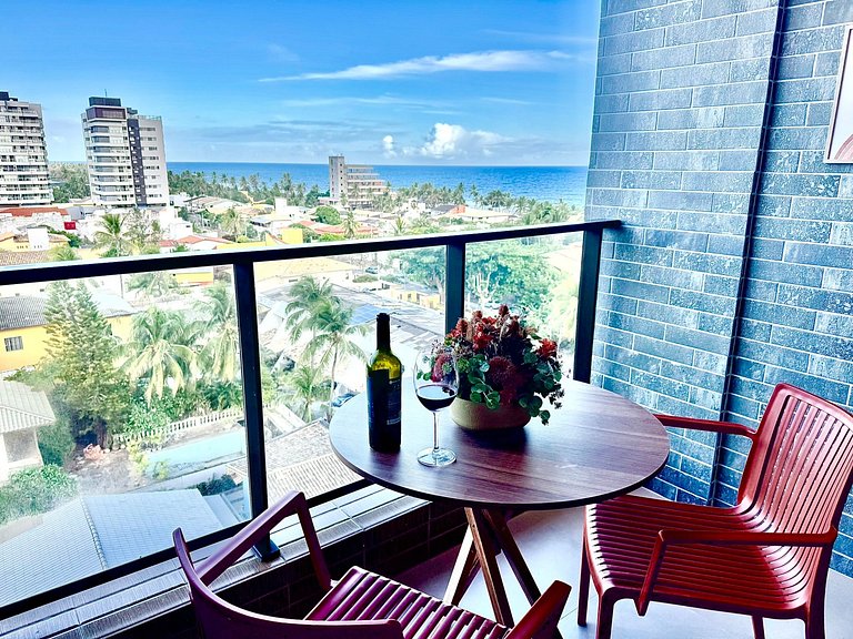 Studio moderno e elegante com vista para o mar