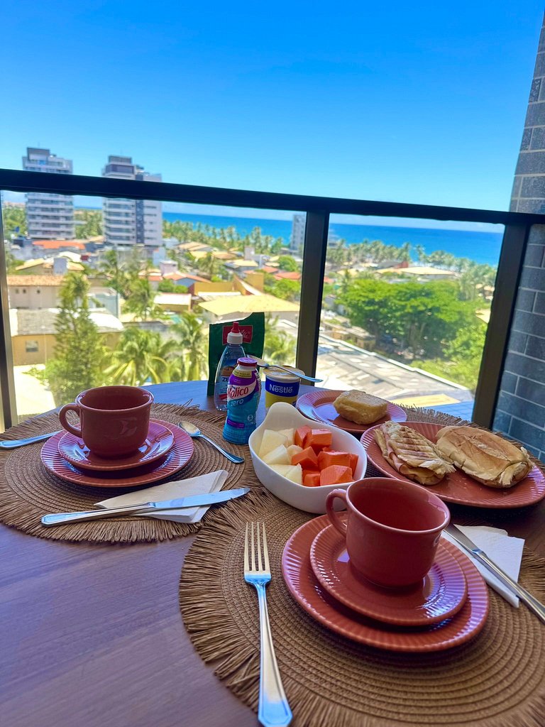 Studio moderno e elegante com vista para o mar