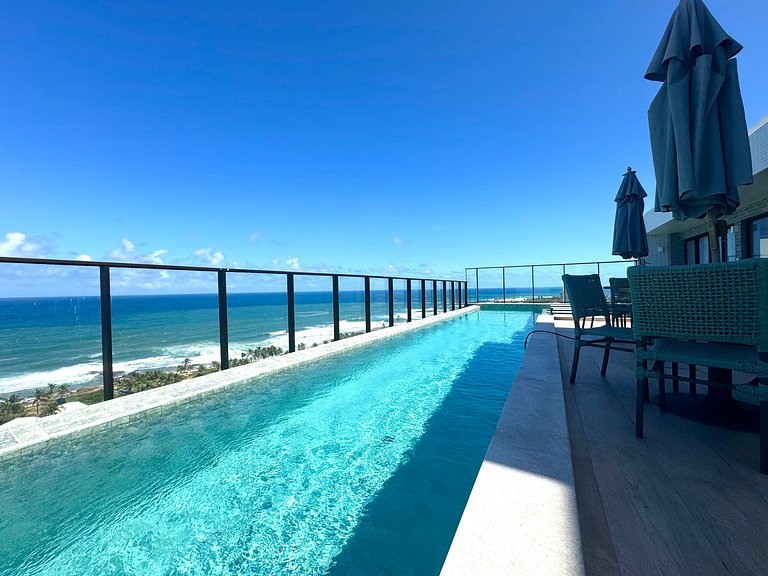 Studio moderno e elegante com vista para o mar